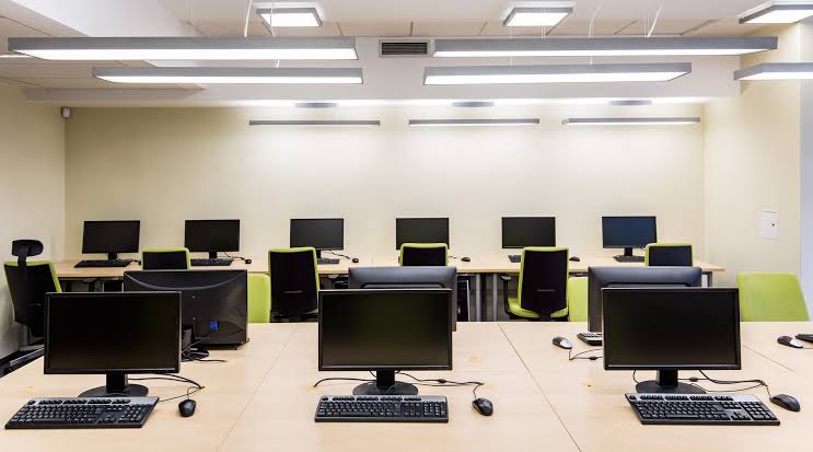 Students working together in a computer classroom